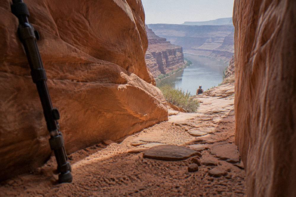 Sculpted sandstone walls of a narrow desert slot canyon glowing in warm reflected light