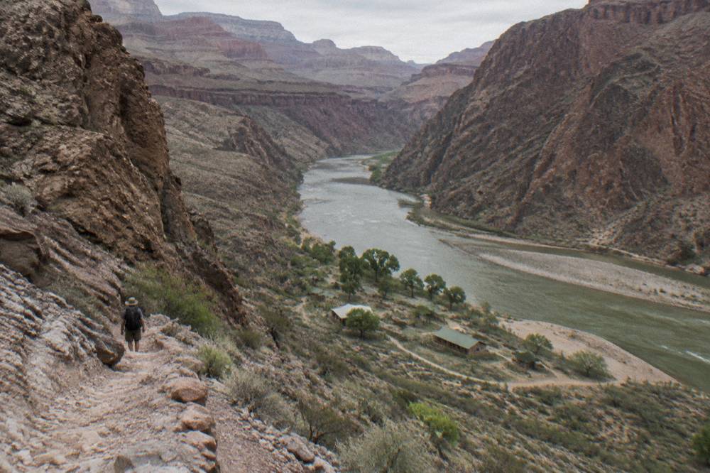 A remote stretch of the Colorado River winding between sheer rock cliffs far from any road